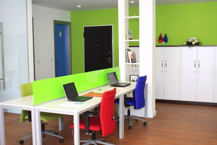 Bright work desks with laptops
